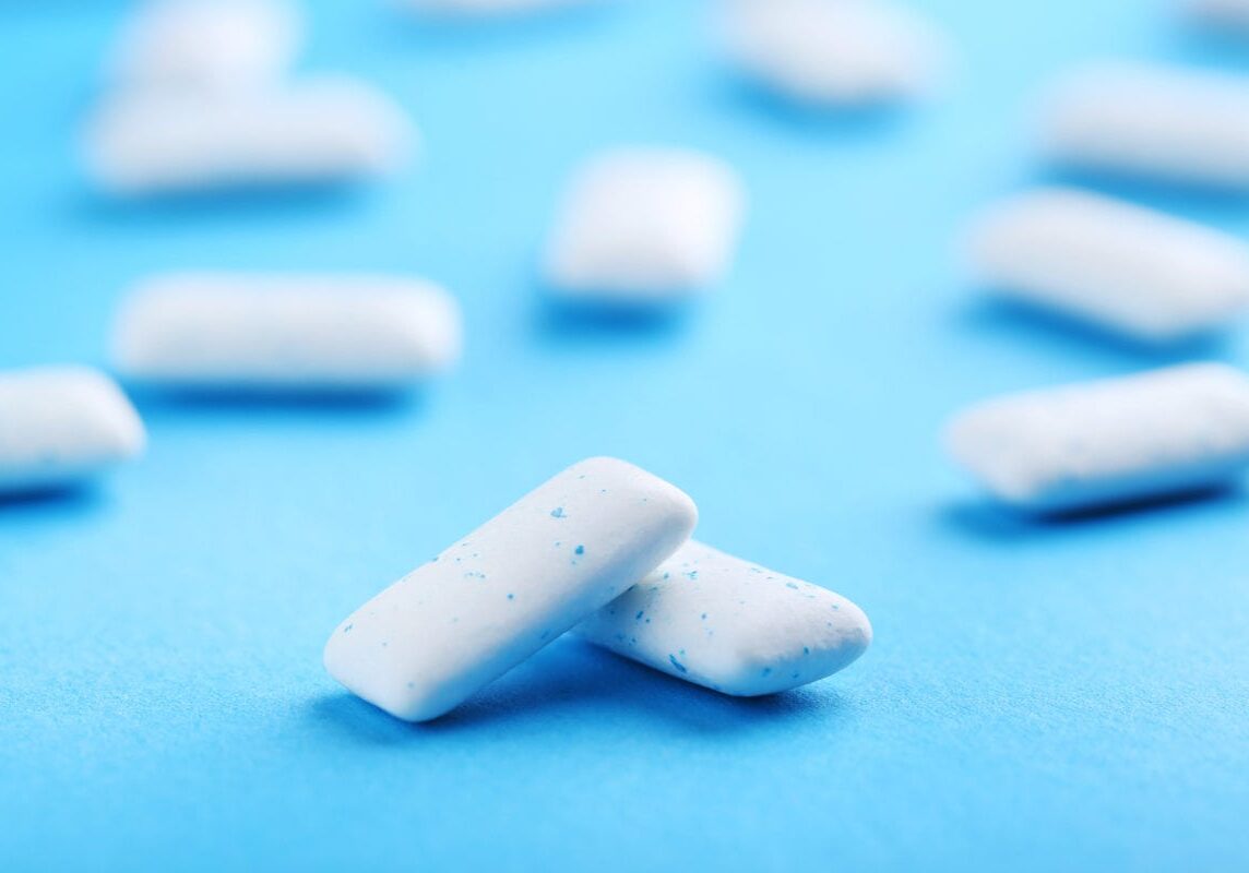 Chewing gums on blue background